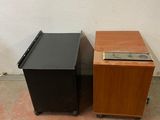 two black and brown speakers sitting next to each other