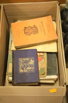 a box full of books that are sitting on the floor