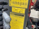 a close up of a gas pump on the back of a tractor