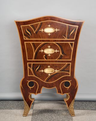 an image of a wooden chest of drawers on a stand