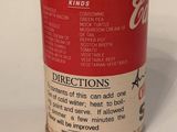 a can of soda sitting on a table with a label on it