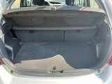 a trunk of a car with the back seats folded down