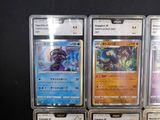 many different types of pokemon cards on display