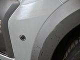 a close up of the front of a silver truck