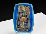 a blue plate with a picture of the virgin and child on it