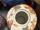 many different vases on the table with a price tag