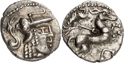 a silver coin with an image of a man on a horse