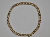 a gold chain bracelet on a white background