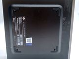 a black box with a label on it on a white surface
