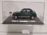 a small green car in a clear display case