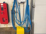 a yellow container with a blue hose attached to it and a yellow container with a blue hose attached to it