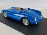 the model of a blue sports car is on a black platform
