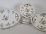 several plates are stacked on top of each other on a table