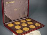 an image of a box of gold coins with a certificate in it