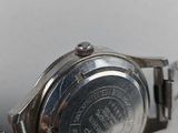an image of a close up of a wrist watch on a white surface
