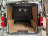 the back of a van with the door open and the back of the van with the back door open