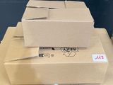 many boxes stacked on top of each other on a table