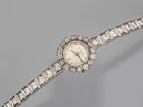 a lady ' s watch with diamonds on a bracelet