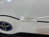 a close up of a toyota logo on the front of a car