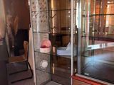a glass display case in the middle of a room