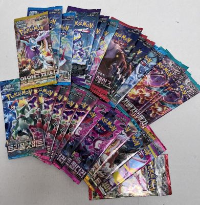 a close up of a bunch of pokemon cards on a table