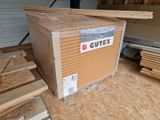 a box that is sitting in the middle of a pile of wood