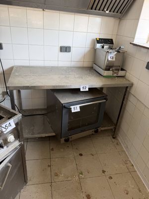 a kitchen with a stove, oven, and sink in it