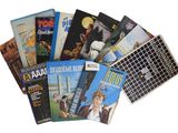a lot of books that are sitting on a table