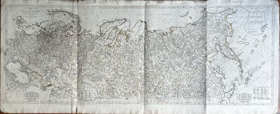 une vieille carte du monde dessinée sur une feuille de papier posée sur une table