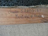 a wooden sign that has writing on it