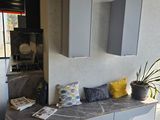 a picture of a kitchen with a marble counter top