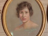 a picture of a painting of a woman in a gold frame