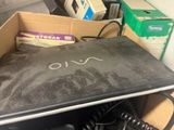 a laptop that is sitting in a box on the floor