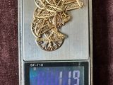 a small scale with a gold heart on it