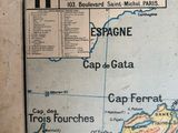 a map hanging on the wall of a room