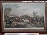 a picture of a painting of a horse race on display