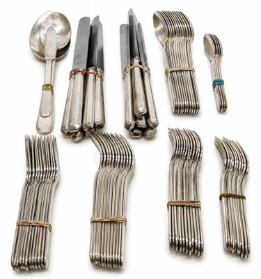 many forks and spoons laid out on a white surface