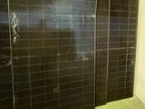 four panels of solar panels in a room