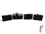 three black suitcases sitting next to each other on a white surface