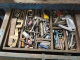 a drawer full of tools that are sitting on a table
