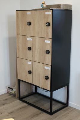 an image of a black and wood cabinet in a living room