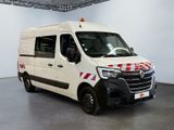 a white van with red and white stripes parked in a room