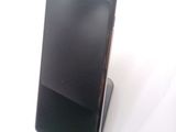 a cell phone that is sitting on top of a stand