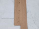 a close up of two pieces of wood on a table