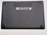 a close up of a laptop on a white surface
