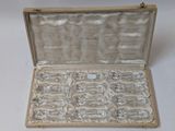 a box with a lot of crystal stones inside of it