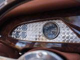 a close up of a car dashboard with a clock on it