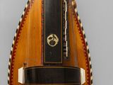 a musical instrument that is hanging on the wall