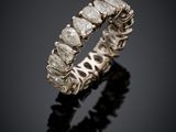a close up of a diamond ring on a black surface