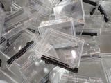 a pile of clear plastic boxes on a table